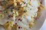 Foto ilustrativa de uma receita pronta de Farfalle ao molho de gozonzola e parmesão